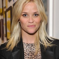 Medium Layered Hairstyle with Bangs