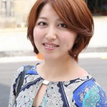 Short Auburn Bob Hairstyle with Side Swept Bangs