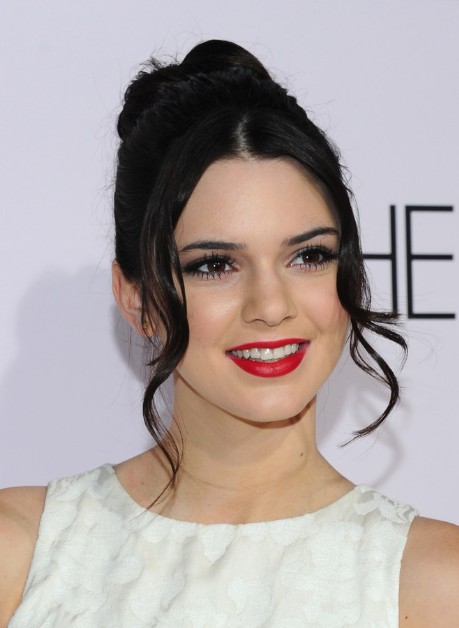 Kendall Jenner Black Messy Bun Updo with Long Tendrils - Hairstyles Weekly
