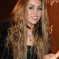 Popular Hairstyles for Girls: Miley Cyrus Long Tousled Curly Hairstyle