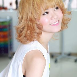 Sweet Short Blonde Curly Hairstyle with Bangs