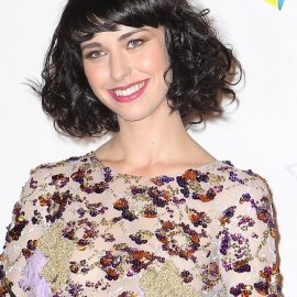 Kimbra Short Black Curly Hairstyle with Bangs