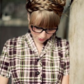 Braided updo with loose curls sleek blunt bangs