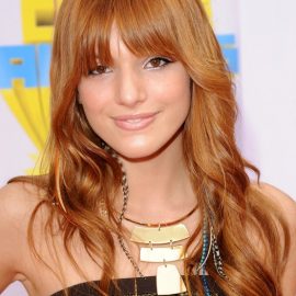 Cute long copper hairstyle with bangs Bella Thorne hairstyle