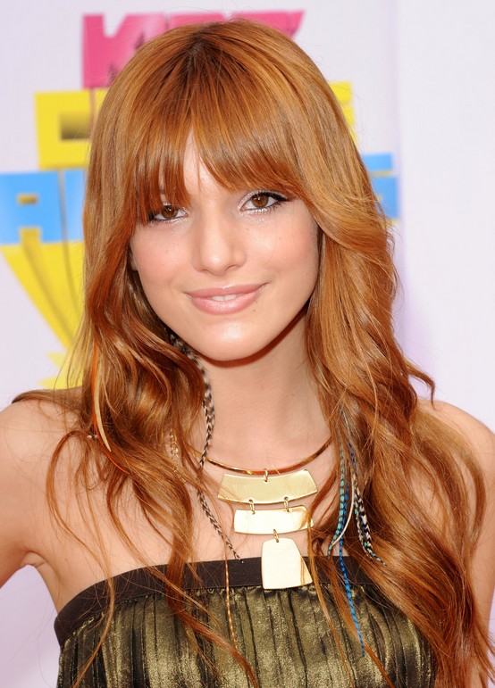 Cute long copper hairstyle with bangs Bella Thorne hairstyle