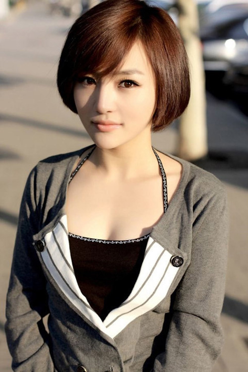 Premium Photo | Smiling young pretty asian woman with korean short hairstyle
