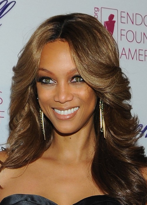 Tyra Banks Feathered Flip Hairstyles for Black Women