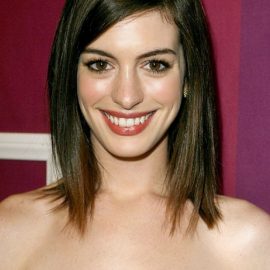 Long Bob (lob) hairstyle with side swept bangs for oval face shapes