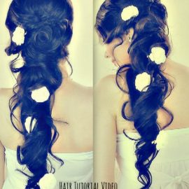 Romantic long curly hairstyle with flowers