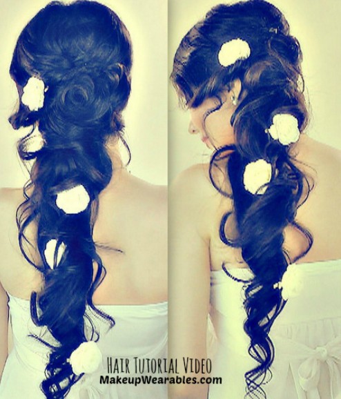 Romantic long curly hairstyle with flowers