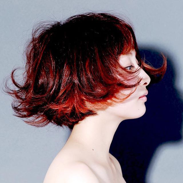 Cool short red wavy bob hairstyle for Asian women