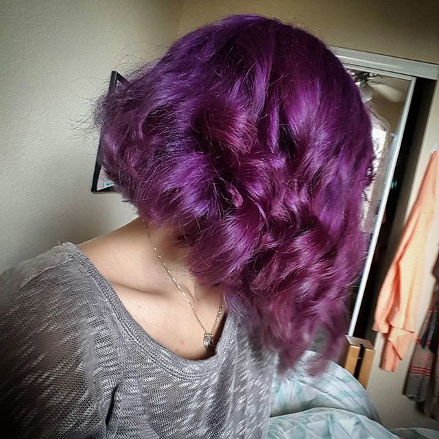 inverted wavy curly purple bob hairstyle