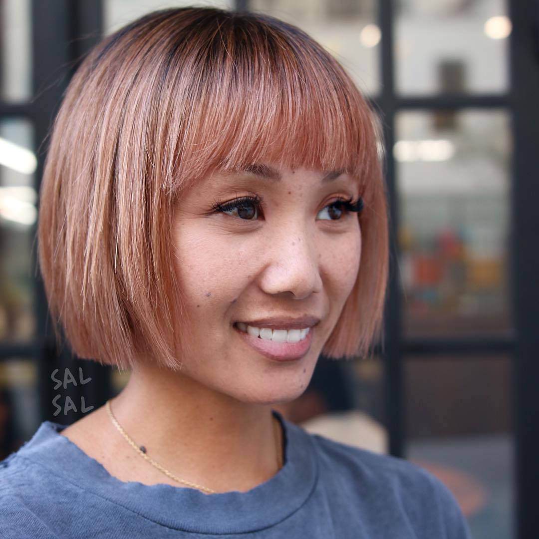 straight blunt pink bob hairstyle with bangs