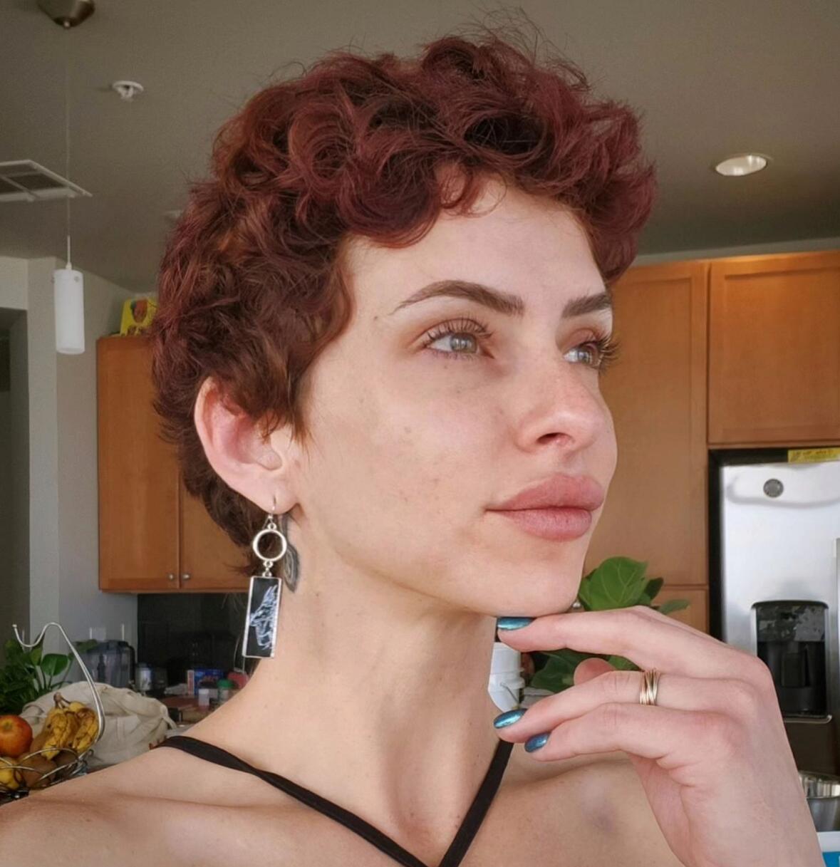 short red curly pixie cut